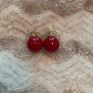 Red colored beaded round post earrings.